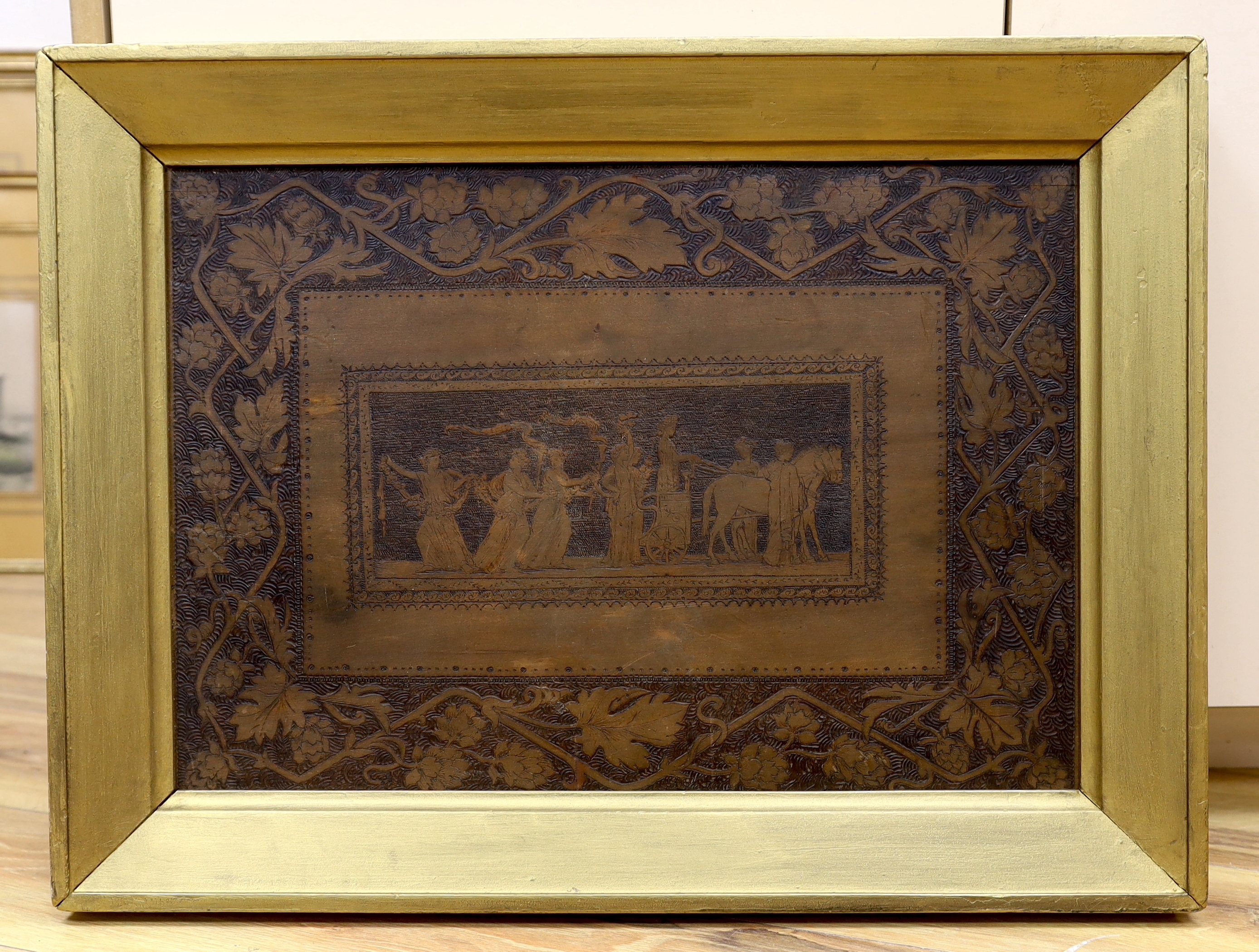 A 19th century Pyrography panel, depicting a classical procession of figures and floral border, 34 x 50cm, gilt framed